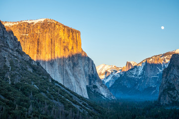 Yosemite Valley Tunnel View at Sunset in Winter. Full Moon. El Capitan and Half Dome. California...
