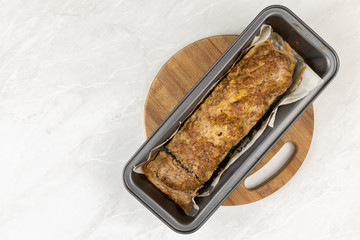 Minced meat meatloaf baked and served on the table
