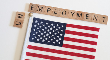 Unemployment concept with text and american flag. Unemployment rates are on the rise worldwide and...
