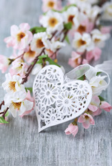 Spring Blossom and heart over wooden background