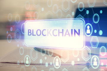 Double exposure of blockchain theme drawings and desk with open notebook background. Concept of...