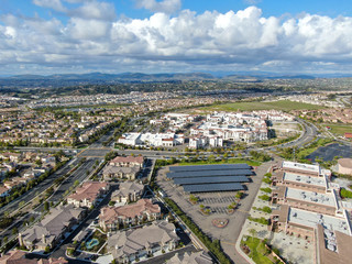 Aerial view of middle class subdivision neighborhood with residential condos and houses in San Diego, California, USA.