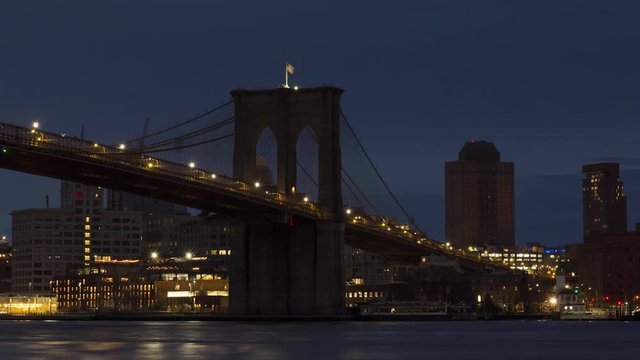 Night to day time lapse Brooklyn Bridge with dumbo from East River