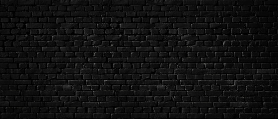 Texture of a black brick wall as a background or wallpaper