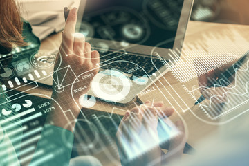 Fototapeta premium Double exposure of man and woman working together and tech hologram drawing. Technology concept. Computer background.