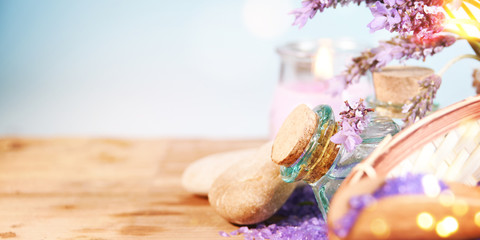 lavender oil in a glass bottle on a background of fresh flowers. Aromatherapy.