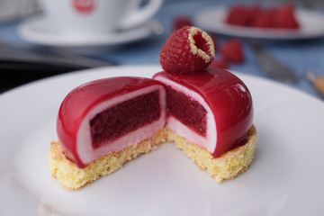 Red dessert on a biscuit, raspberry diet dessert in a cut.