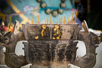 Incense sticks burn in a Buddhist Temple in Hong Kong.