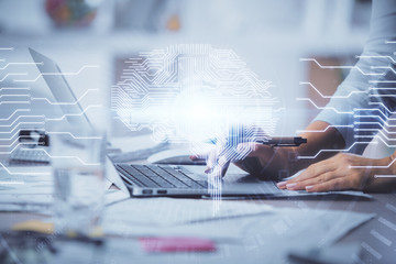 Double exposure of woman hands working on computer and brain hologram drawing. Ai concept.