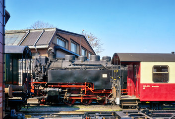 Narrow-gauge railway and railway wagons at a train station in Wernigerode. Steam locomotive in the Harz. Saxony-Anhalt, Germany
