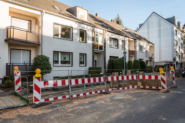 repairing pipeline at the city street. Construction site on a damaged drinking water supply line. Closed to traffic. Underground communications repair, pipeline replacement in Krefeld, Germany