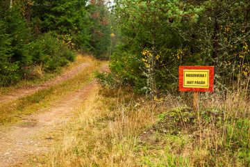 Warning sign with hunting in progress