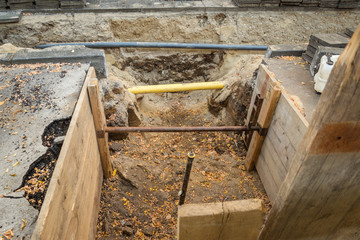 repairing pipeline at the city street. Construction site on a damaged drinking water supply line. Closed to traffic. Underground communications repair, pipeline replacement in Krefeld, Germany