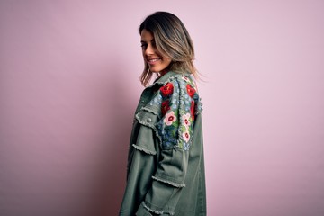 Fototapeta premium Young beautiful woman wearing fashion urban clothes, model wearing casual street style standing over pink background
