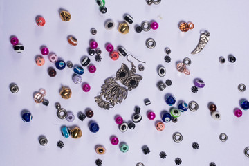 A owl craft and other objects on a white table