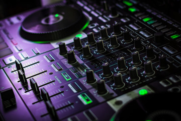 Fototapeta na wymiar Pro DJ Mixer with sliders & knobs with Disc Jockey Turn Tables