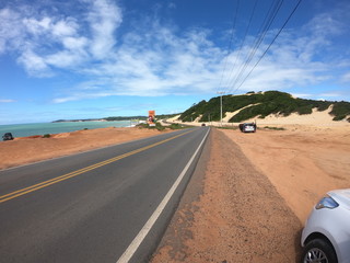 Fototapeta premium Desert and ocean landscape with winding road
