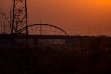 Sunset on the background of the road and antennas. Beautiful landscape. Background.