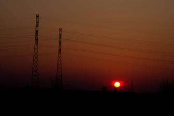 Sunset on the background of the road and antennas. Beautiful landscape. Background.