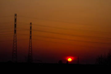 Sunset on the background of the road and antennas. Beautiful landscape. Background.