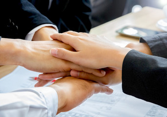 close up of a business team put hands together
