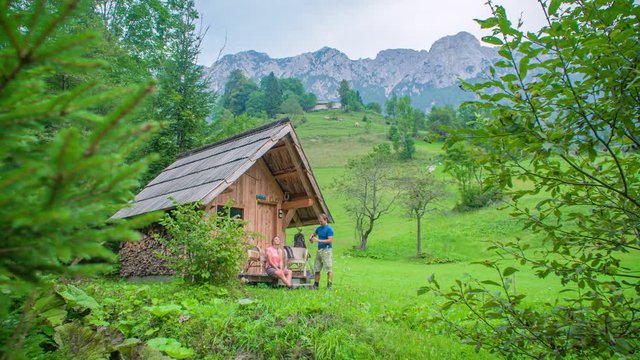Drinking a coffee outside the mountain cabin. Beautiful nature and mountains. Topla Valley, Slovenia