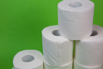 Toilet Paper Rolls on a Green Background