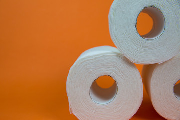 Toilet Paper Rolls on Orange Background