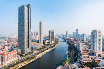 Fototapeta na wymiar Skyline of tall city skyline along the Haihe River in Tianjin, China