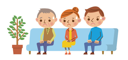 病院・歯科医院の待合室で緊張して待つ患者3人