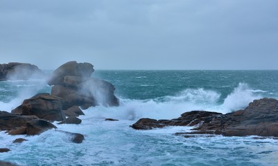 Beautiful view of the pink granite coast during storm in Brittany. France