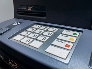 number pin pad at a bank ATM outdoors