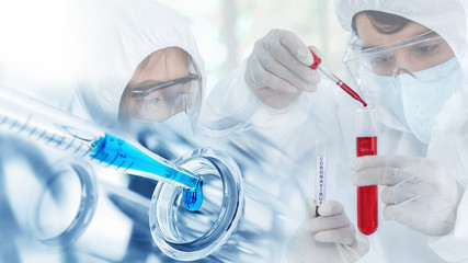coronavirus covid 19 research background of pharmacetical virus research scientist with sample tube of coronavirus covid 19 on hand doing experiment on anti flu drug for coronavirus covid 19 treatment