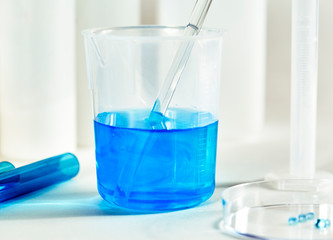 Blue Liquid in a Measuring Cup with Glass Stir