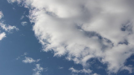 deep blue sky with cumulus white clouds