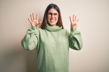 Young beautiful woman wearing casual sweater standing over isolated white background showing and...