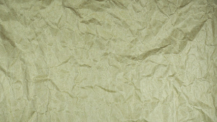 Brown wrinkled paper. Abstract texture background.