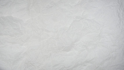 Wrinkled white paper. Abstract wallpaper texture. 