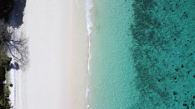 amazing and beautiful top view Tropical with beach waves break on white sand beach,Video above turquoise blue sea water on the white sand shore beach Thailand
