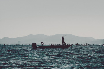 bass boat in the lake film grain