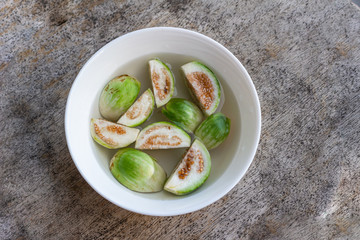 Thai vegetables. Eggplant on water in a white plate, ready to be used for cooking