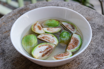 Thai vegetables. Eggplant on water in a white plate, ready to be used for cooking