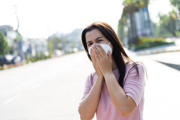 Close up of a woman in a suit wearing Protective face mask and cough, get ready for Coronavirus and...