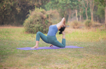 Woman yoga-Beautiful position ,relax  and happy  in nature.