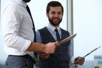 Group of modern businesspeople in office debate on financial issue hold in arms documents portrait. Success assessment human resources data analysis person