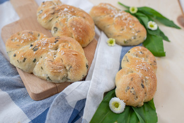 home made bread rolls with wild garlic on a table