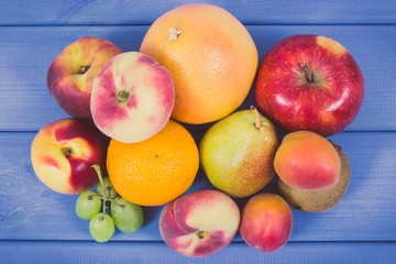 Naklejka na ściany i meble Fresh natural fruits containing nutritious vitamins for healthy lifestyles. Vintage photo