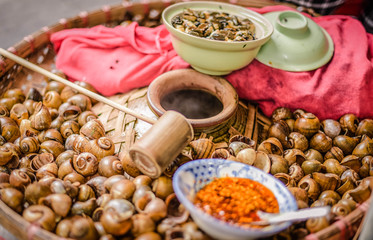 Boiled clams packaged in a popular food jar in Hanoi, Vietnam