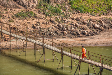 Fototapeta na wymiar Bamboo bridge over the Kan River, Luang Prabang, Laos