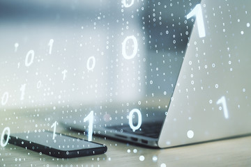 Double exposure of creative abstract binary code hologram on laptop background. Database and programming concept